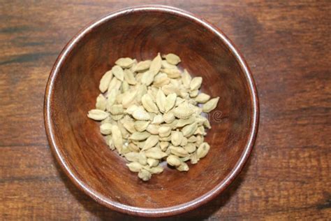 Green Cardamom in Wooden Bowl Stock Photo - Image of recipes, wooden ...