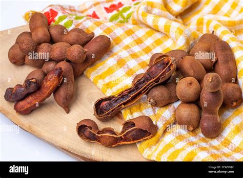 tamarind fruit pods isolated   white background stock photo alamy