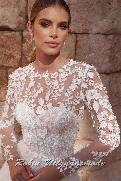 A-line wedding dress with floral lace bodice and sleeves