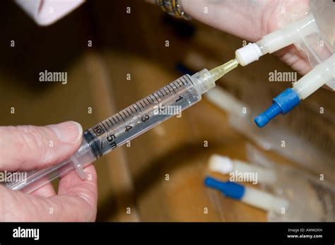 nurse preparing iv medication  patient stock photo alamy