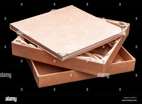 beige book  hardcover lying   black background stock photo alamy