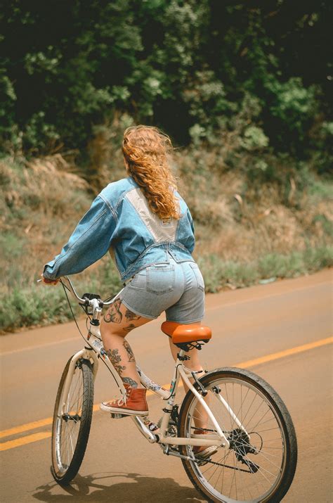 Woman Riding White Bicycle · Free Stock Photo
