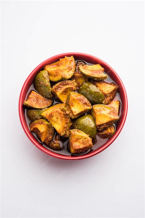 Premium Photo | Indian homemade raw mango pickle or aam ka achar or