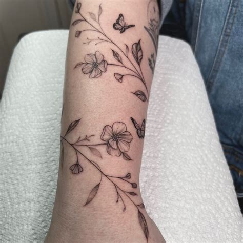 Delicate Floral Vine Tattoo