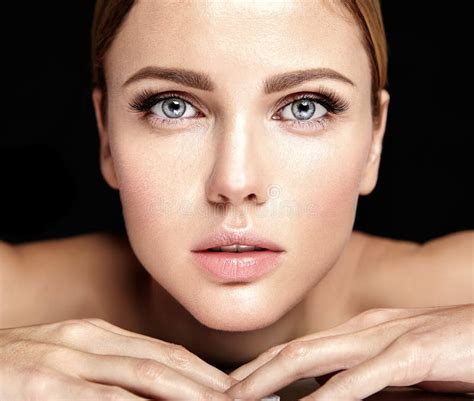 Portrait of Beautiful Woman Model with Makeup and Clean Healthy Skin