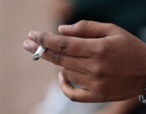British lawmakers vote in favour of strict anti-smoking rules | Reuters