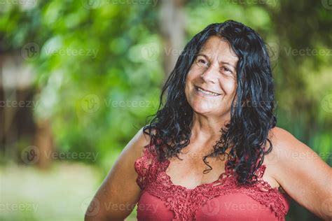 Portrait of smiling beautiful middle age. mature. older female farmer