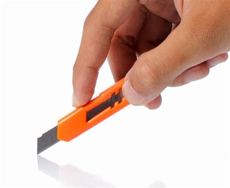 hand holding cutter cutting  stock   royalty