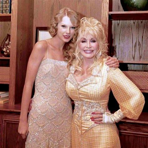 two women standing next to each other in front of bookshelves