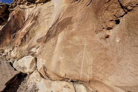 Petroglyphs along the cliffs at the second site. Likely a water glyph ...