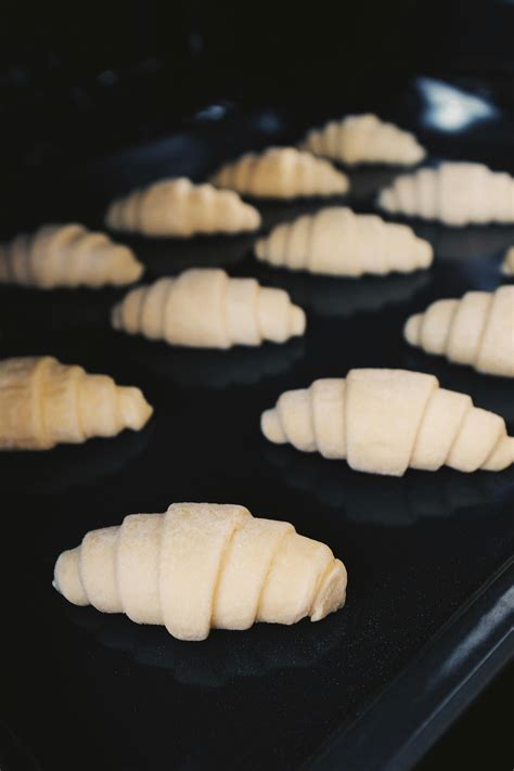 Fresh raw croissant dough on metallic mold before cooking · Free Stock ...