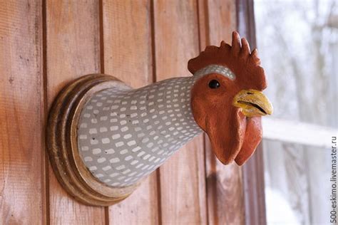 a rooster head mounted to the side of a wooden door with polka dot ...