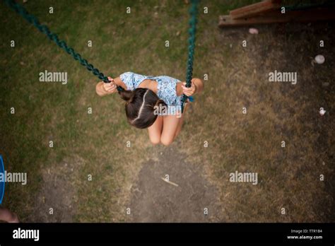 girl swinging high  res stock photography  images alamy