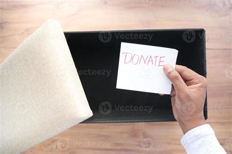 holding a paper with hand written donation text top view 5282100 Stock ...
