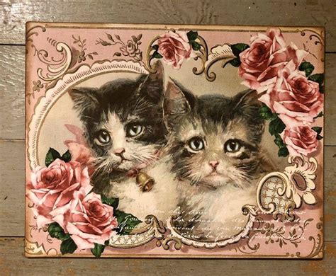 two kittens with roses on a pink and white background, one is looking ...