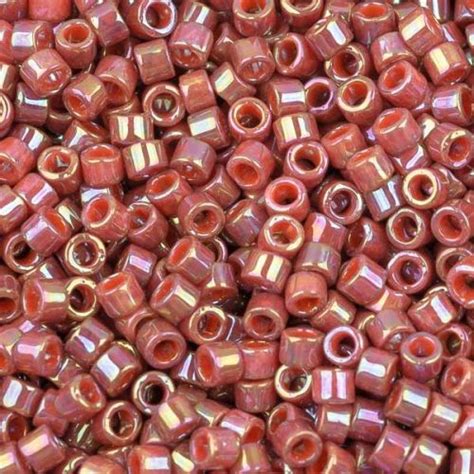 red glass beads are stacked on top of each other