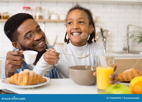 Little Girl and Her Father Having Breakfast Together Stock Image ...