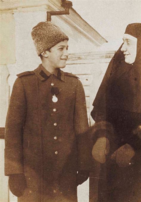 A smiling Alexei Nikolaevich Romanov and his teacher in captivity in ...
