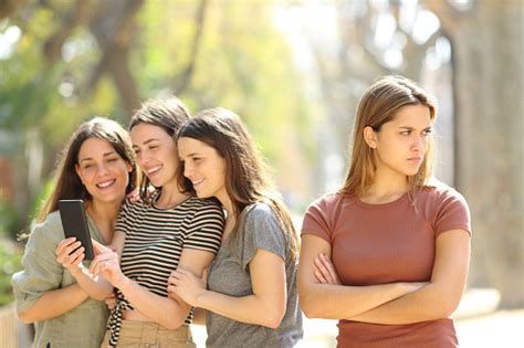 Angry Woman Being Ignored By Her Friends In The Street Stock Photo - Download Image Now - iStock