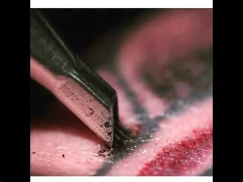 tattooing  close  slow motion youtube