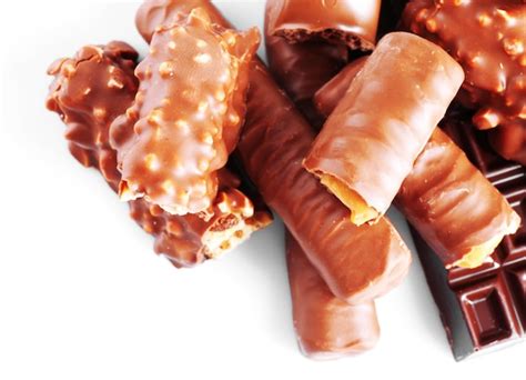 Premium Photo | Mix of chocolate bars on table closeup