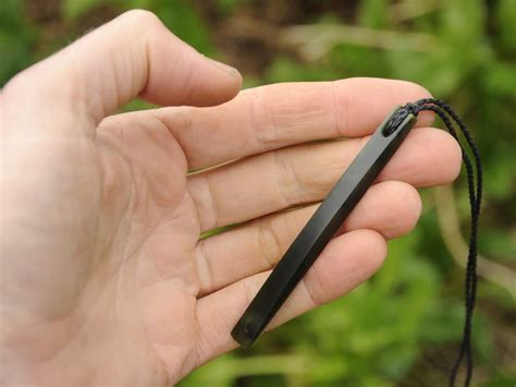Dark Pounamu Drop — A Carved Piece