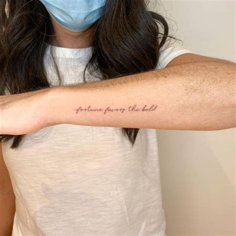 "Fortune favours the bold" lettering tattoo on the