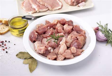 diced meat   white plate composition  raw poultry pork meat