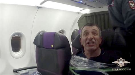 INCIDENT S7 Airlines passenger taped to seat after trying to storm ...