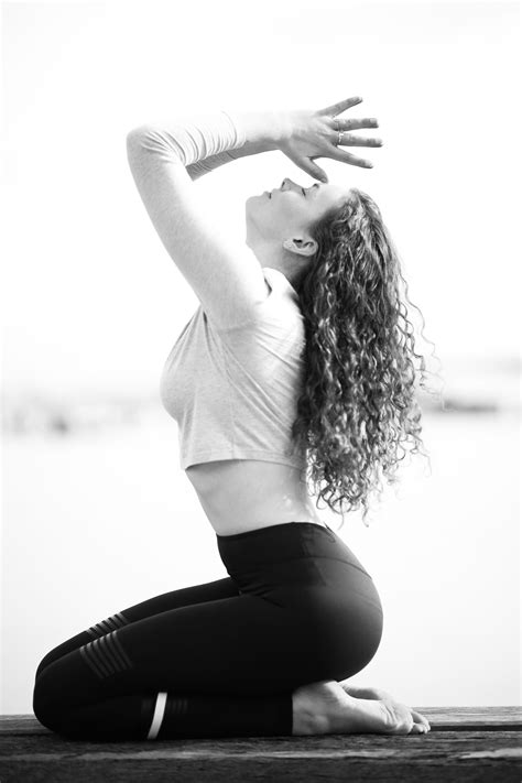 Anjali Mudra prayer hands. Yoga photoshoot by the seaside. Photography