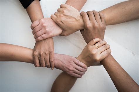 people united hands   teamwork premium photo
