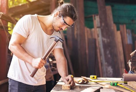 Premium Photo | Man working on wood