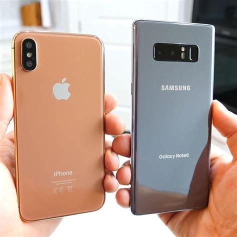 two people holding up their new samsung phones