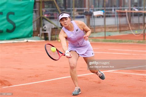 Yuriko Lily Miyazaki of Great Britain plays a forehand during her ...