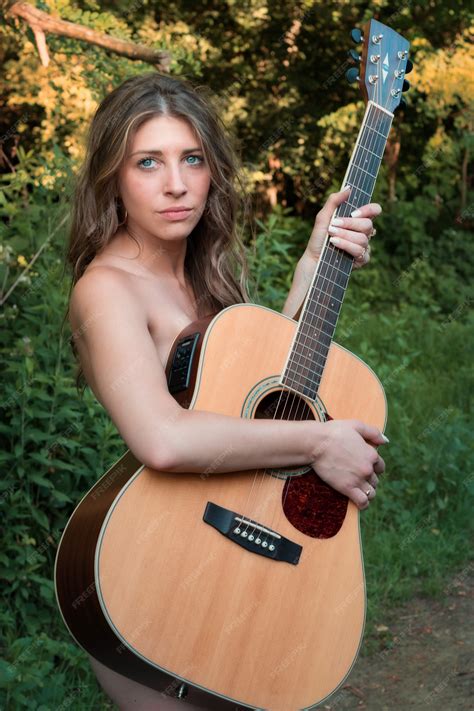 Premium Photo | Beautiful naked blonde with guitar