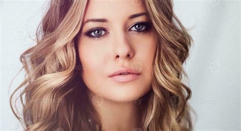 Beauty, makeup and glamour look. Beautiful blonde woman with curly