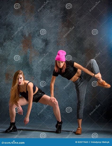 The Two Attractive Girls Dancing Twerk in the Studio Stock Image