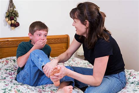 50+ Family Mother And Son Tickling Feet Stock Photos, Pictures ...