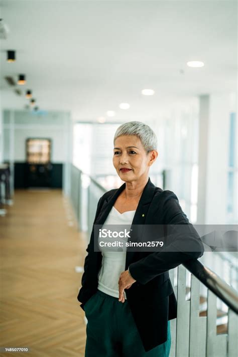 exuding confidence  chic mature asian woman   job stock photo