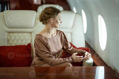 attractive woman on a private jet 5884809 Stock Photo at Vecteezy