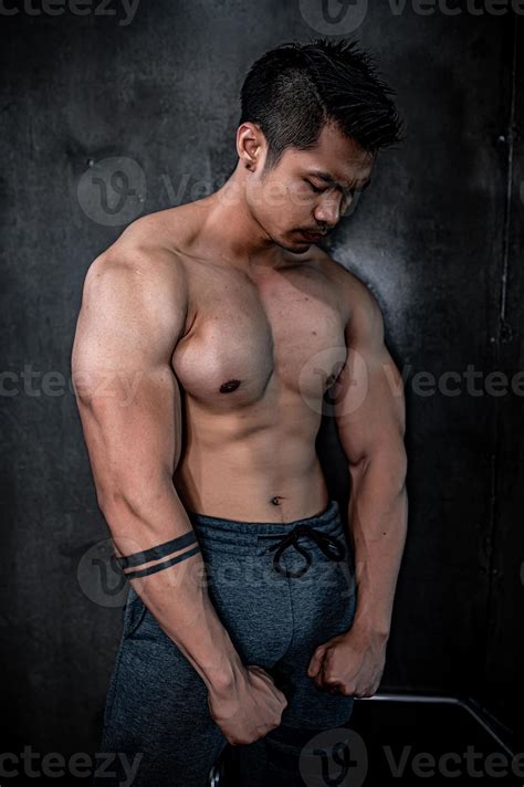 Portrait of asian man big muscle at the gym,Thailand people,Workout for