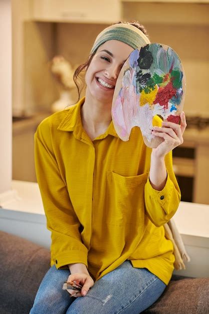 Premium Photo | Cute female artist looking happy and enjoyed