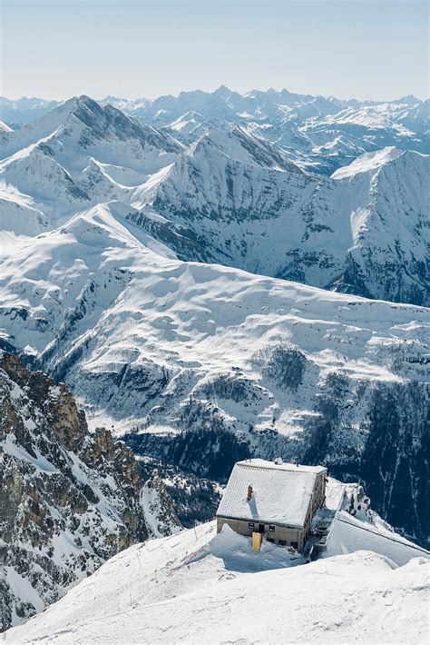 "Winter Mountain Cabin Covered In Snow In The Top Of The Alpine