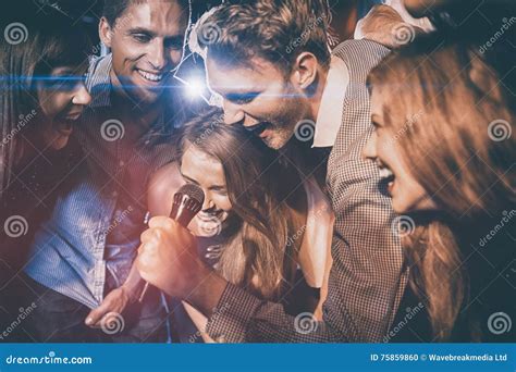 Happy Friends Singing Karaoke Together Stock Photo - Image of ...