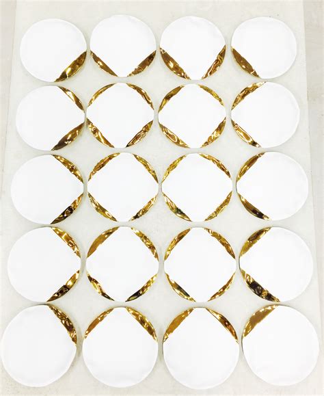 Stepanka Horalkova, white porcelain pillows with 22K gold — Michele Mariaud