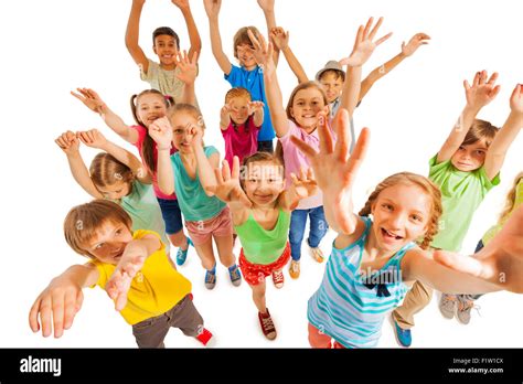 Cheering kids lifting hands up in air Stock Photo - Alamy