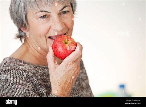 ELDERLY PERSON EATING FRUIT Stock Photo - Alamy