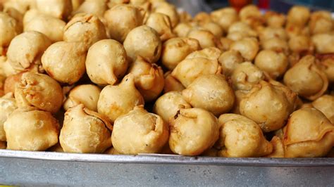 Fried stuffed pastry 13603496 Stock Video at Vecteezy