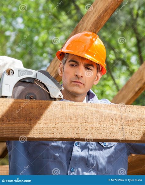 Construction Worker Using Electric Saw on Timber Stock Photo - Image of