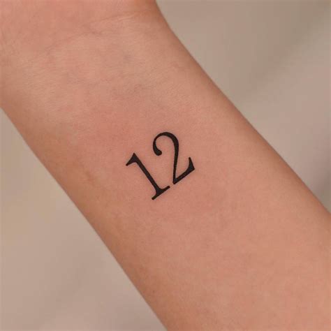 Number "12" tattooed on the wrist